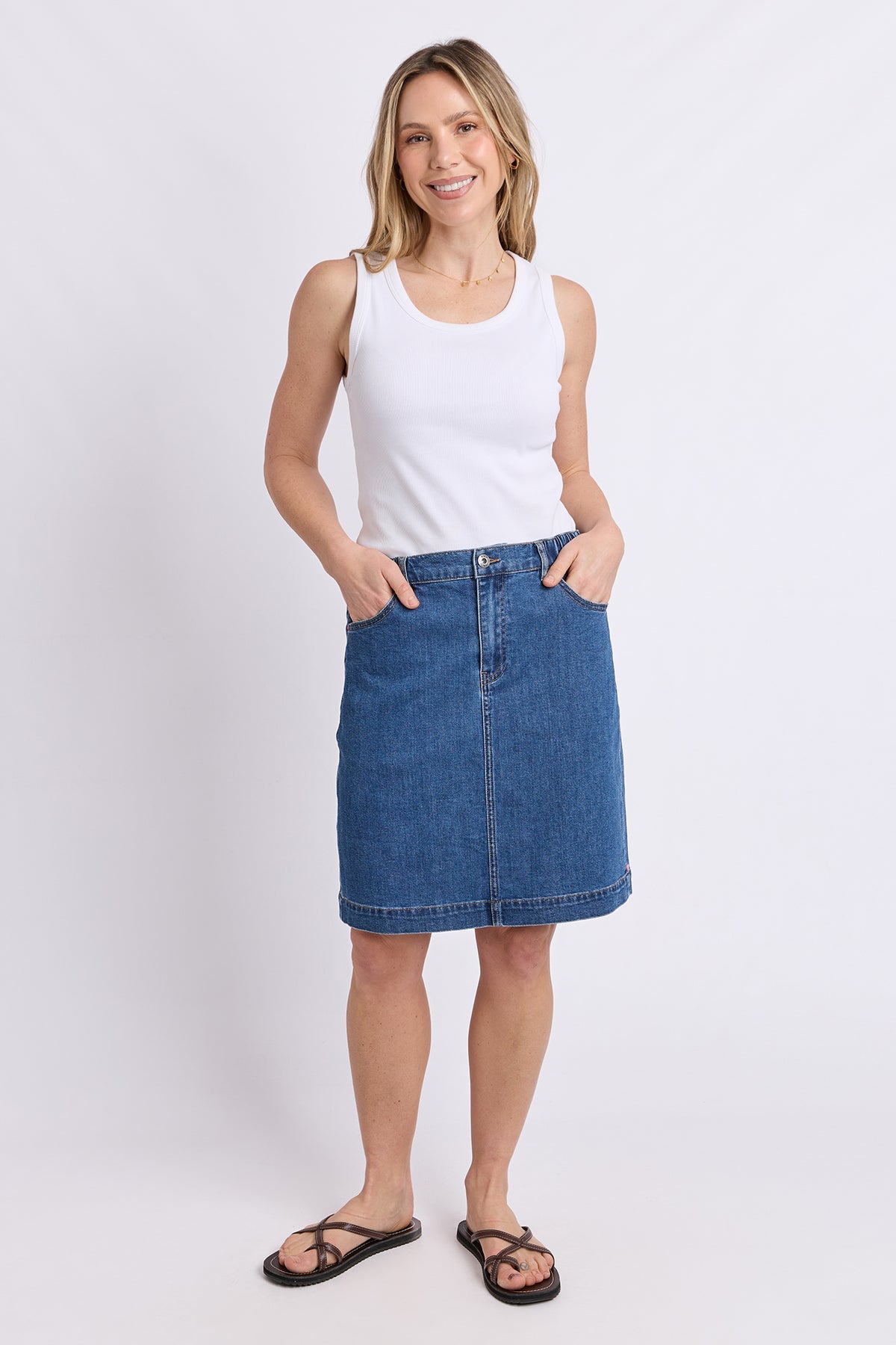 Elm Birdie Denim Skirt in Mid Blue Wash, styled lifestyle shot