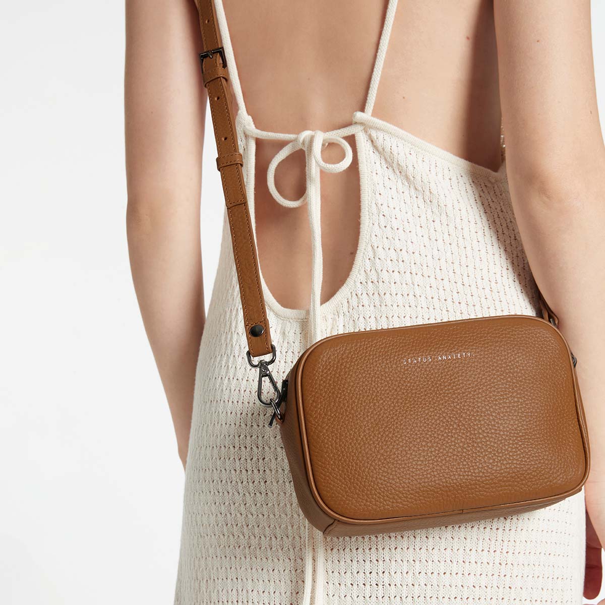 Status Anxiety Plunder Bag in Camel, styled lifestyle shot