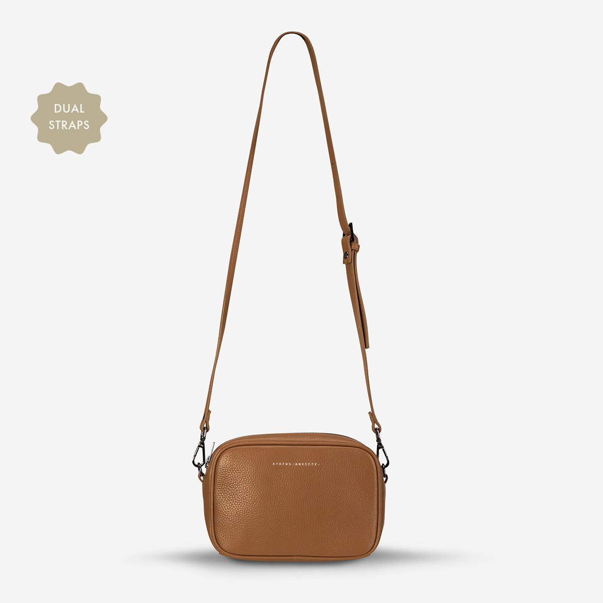Status Anxiety Plunder Bag in Camel with leather strap, front view