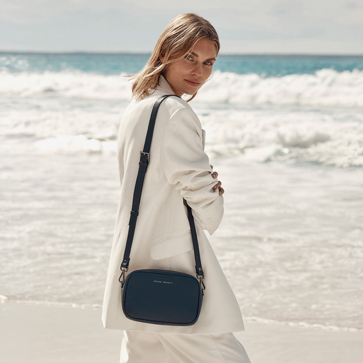 Status Anxiety Plunder Bag in Midnight Blue, styled lifestyle shot