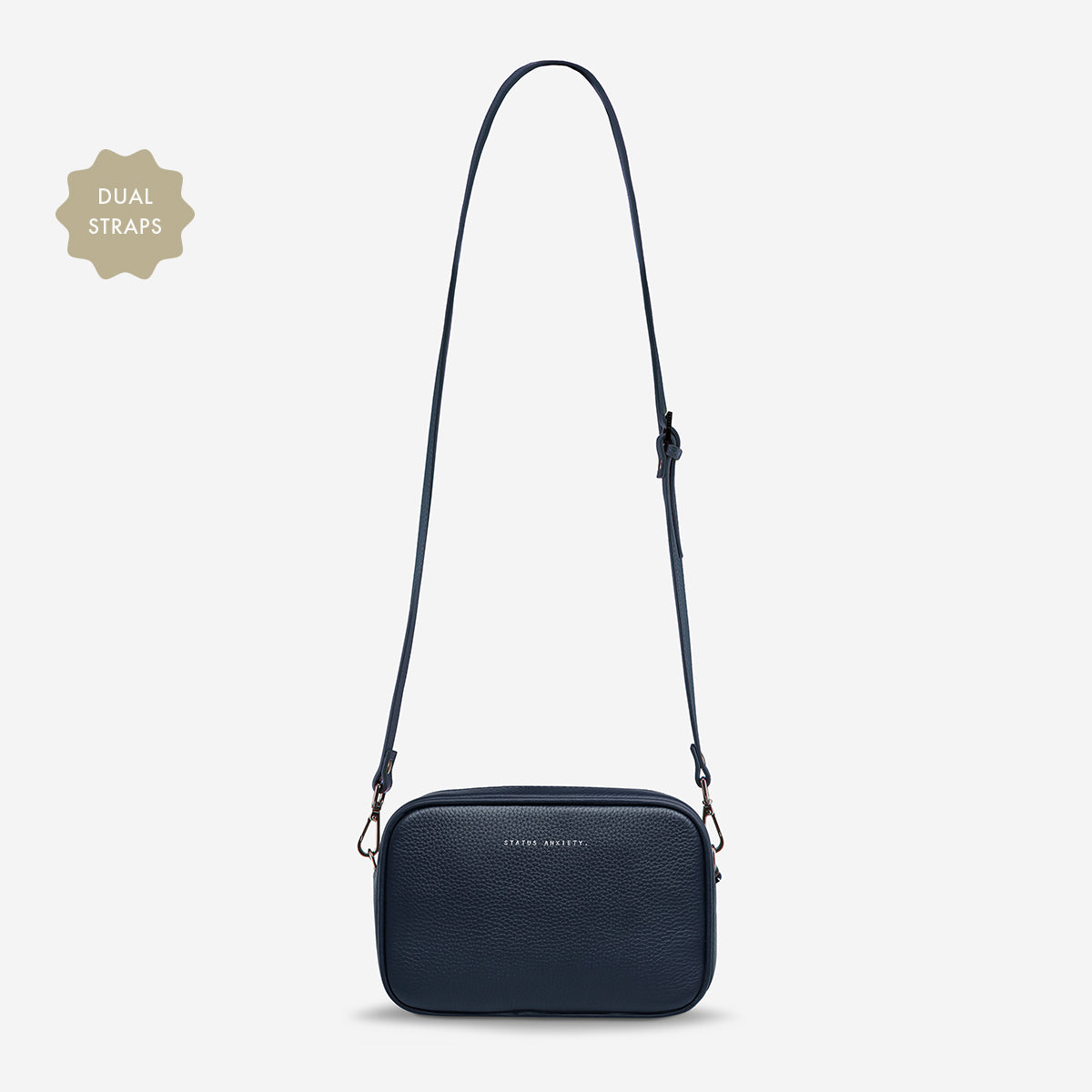 Status Anxiety Plunder Bag in Midnight Blue with leather strap, front view