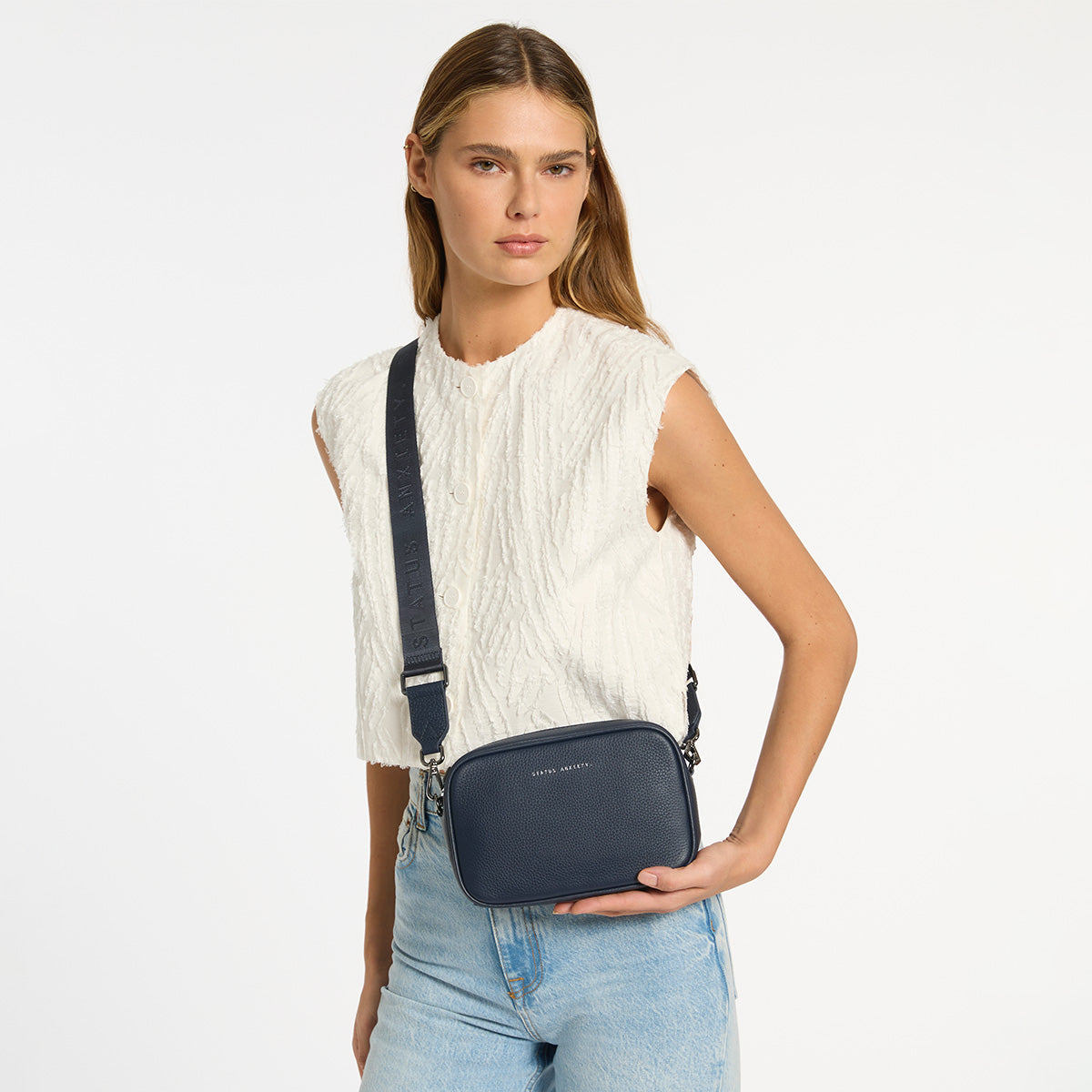 Status Anxiety Plunder Bag in Midnight Blue, styled lifestyle shot
