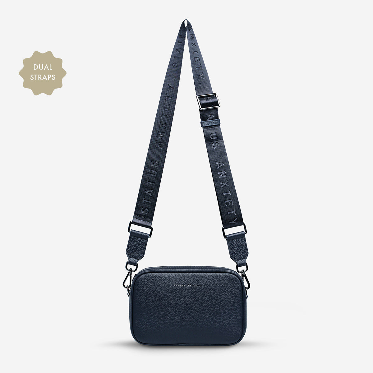 Status Anxiety Plunder Bag in Midnight Blue with web strap, front view