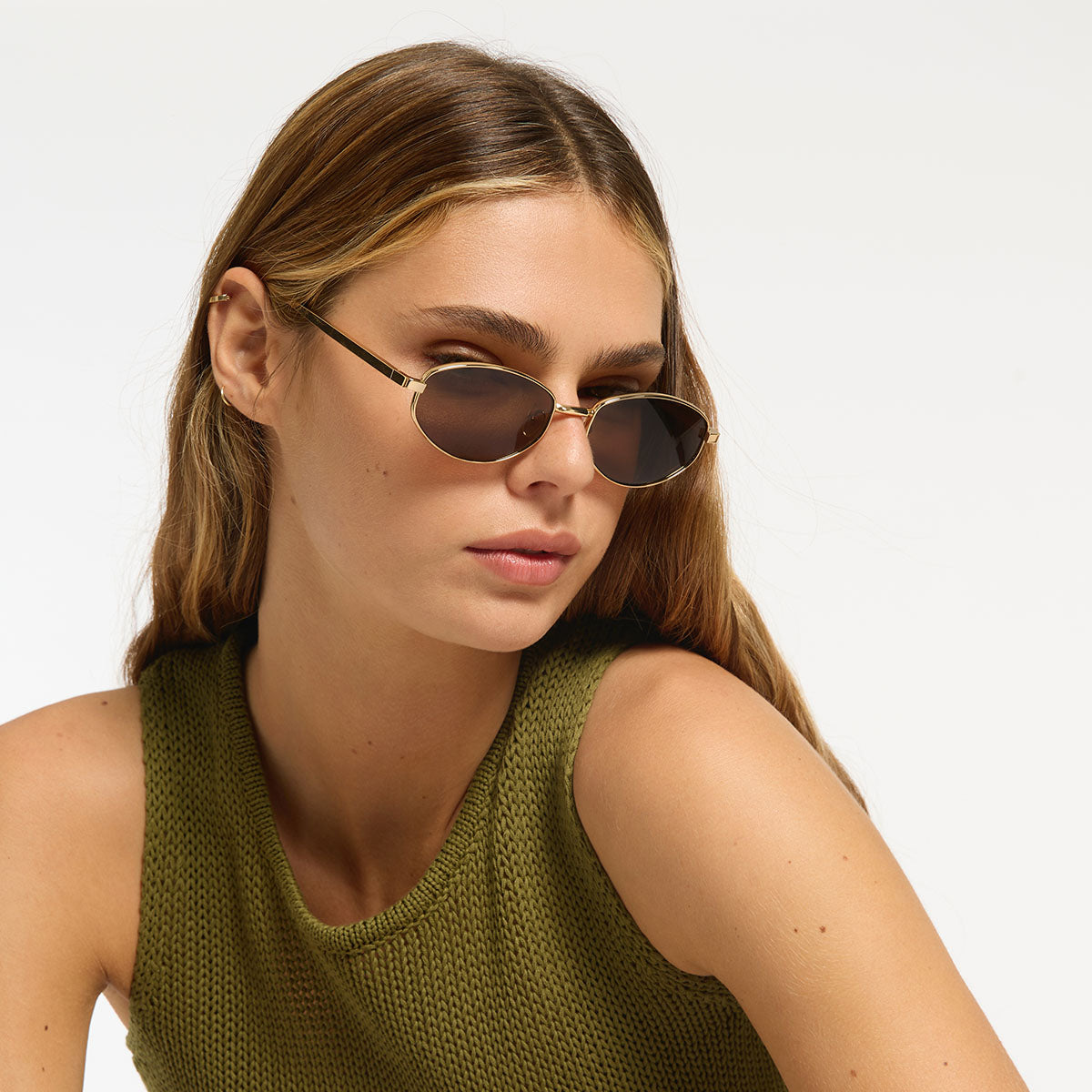 Status Anxiety Enigma Sunglasses in Gold, lifestyle image