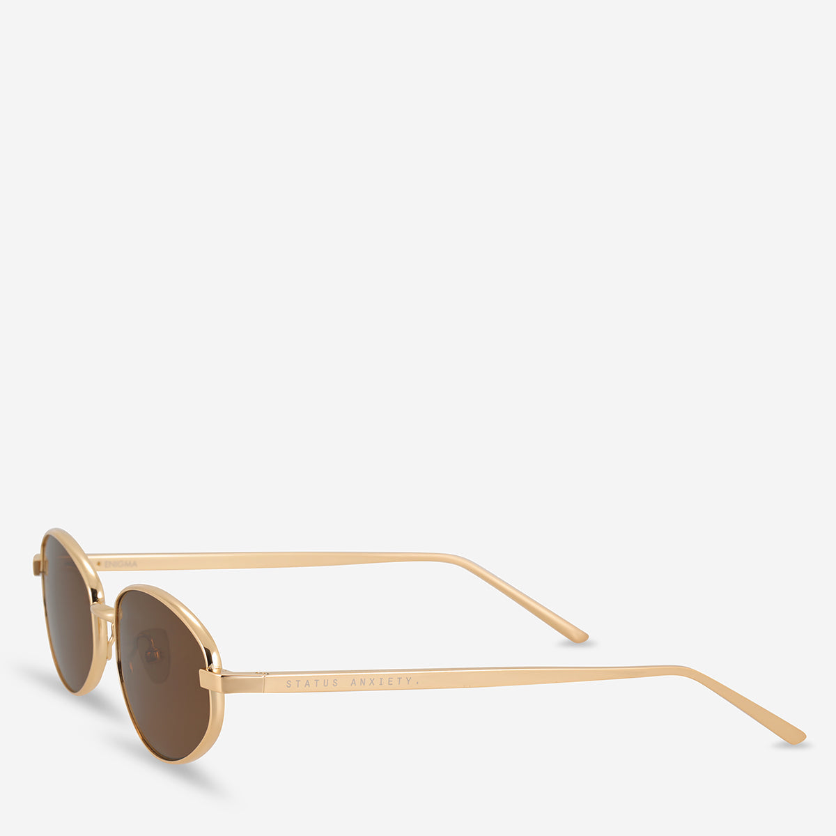 Status Anxiety Enigma Sunglasses in Gold, front side view